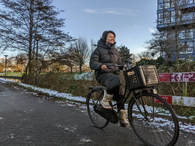 Emi cycling through a snowy Griftpark